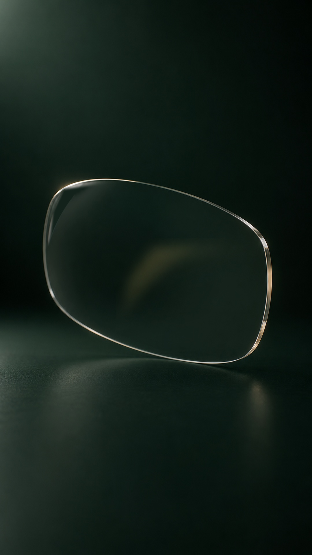 A near-clear lens with its original glass edges and a faint champagne surface reflection